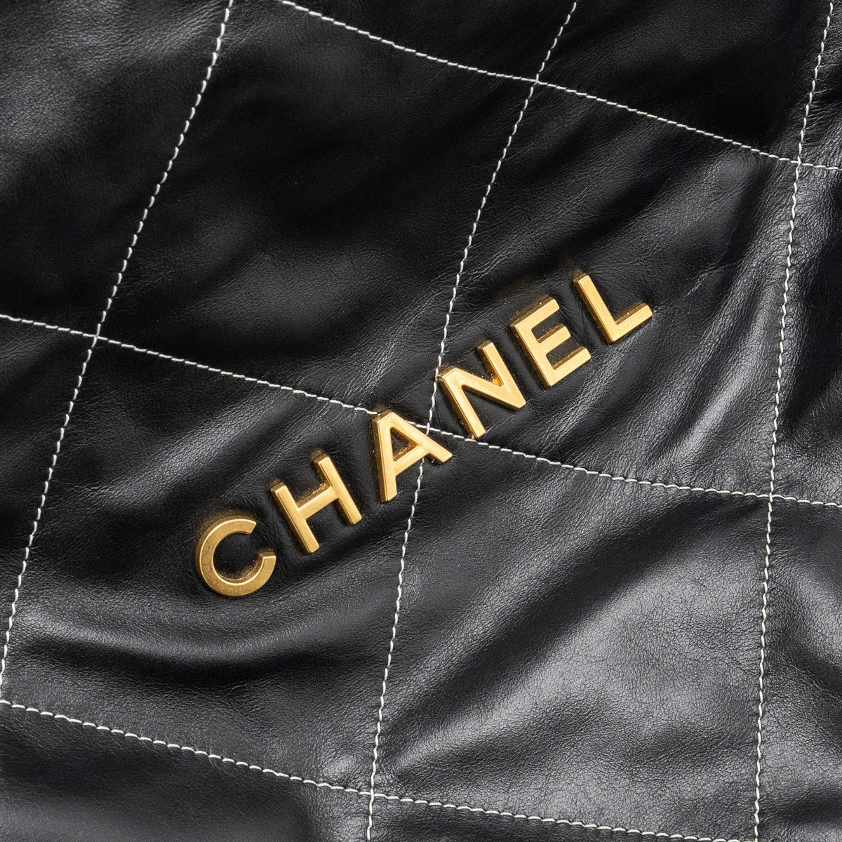 chanel-medium-22-bag-shiny-calfskin-black-with-white-stitching-gold-letter-ghw