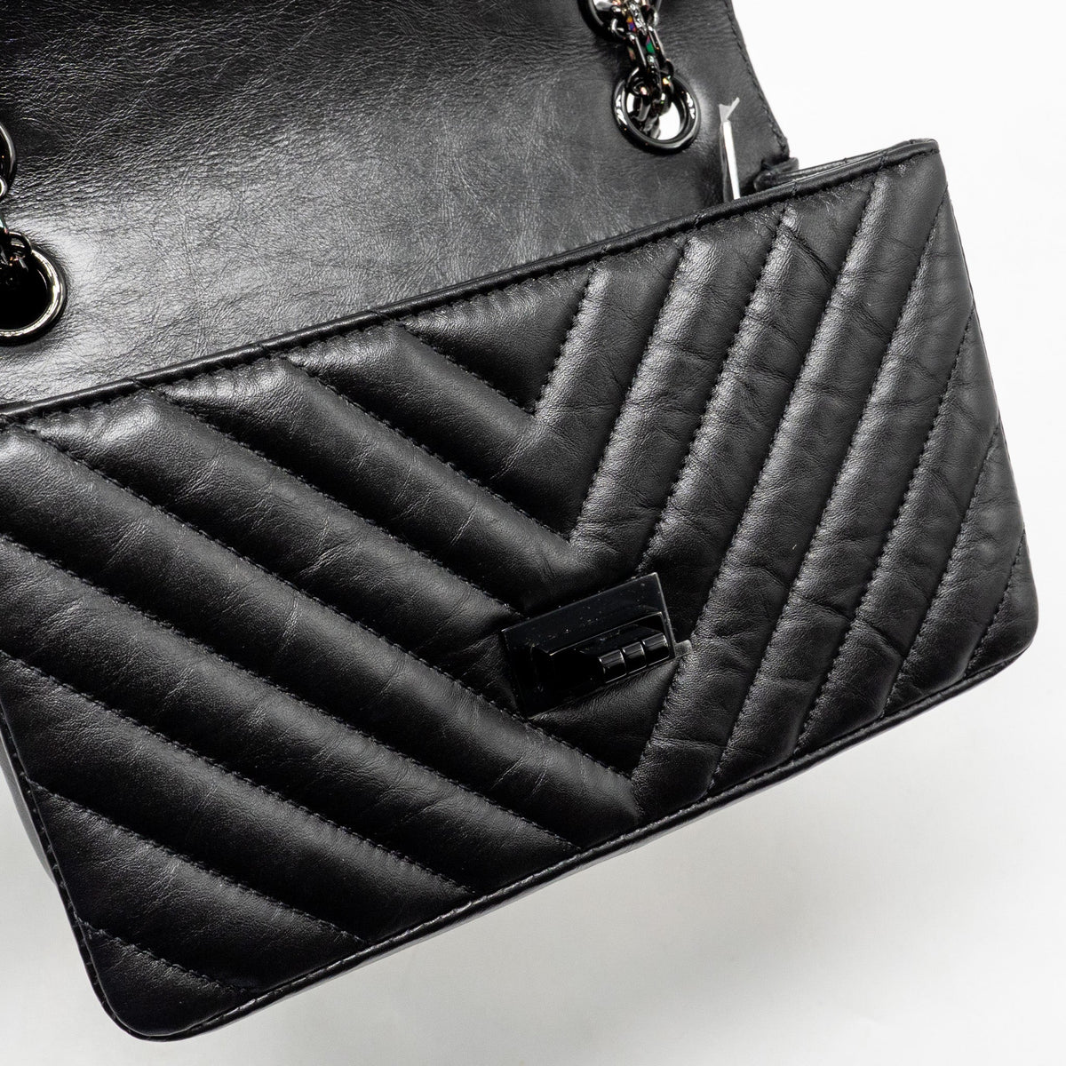 chanel-mini-2-55-reissue-flap-bag-chevron-aged-calfskin-so-black