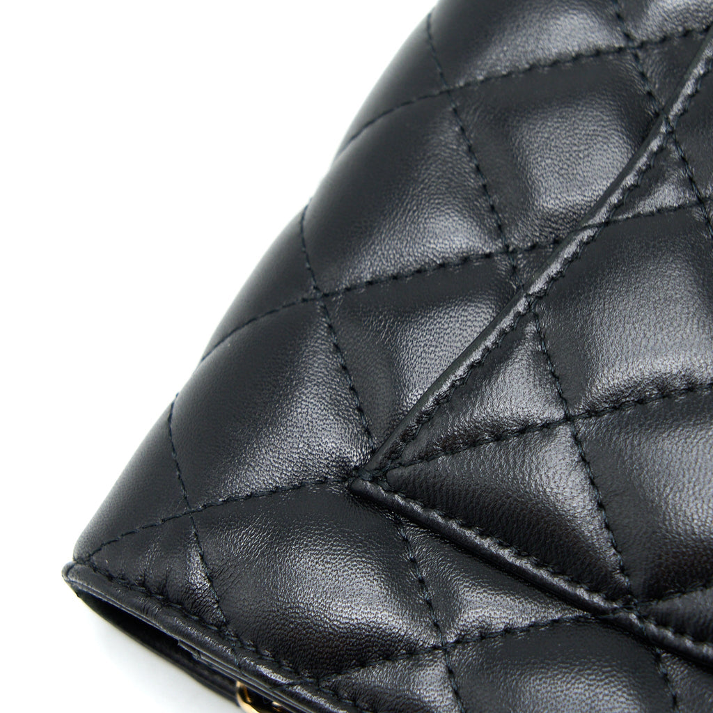 chanel-quilted-wallet-on-chain-with-camellia-chain-lambskin-black-lghw
